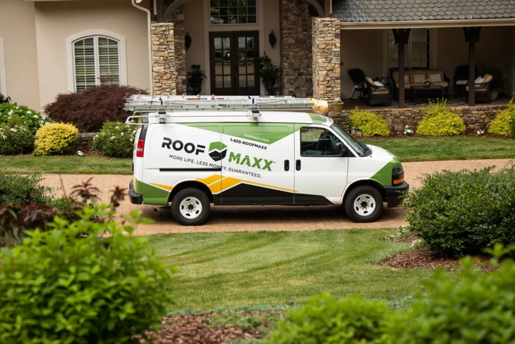 roof maxx van in front of house