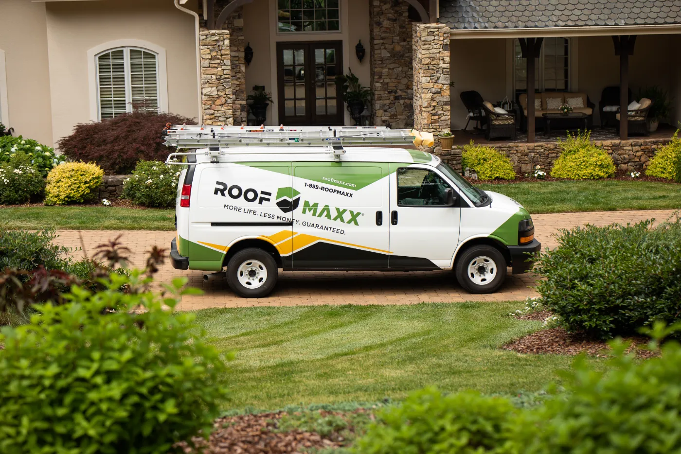 roof maxx van in front of house