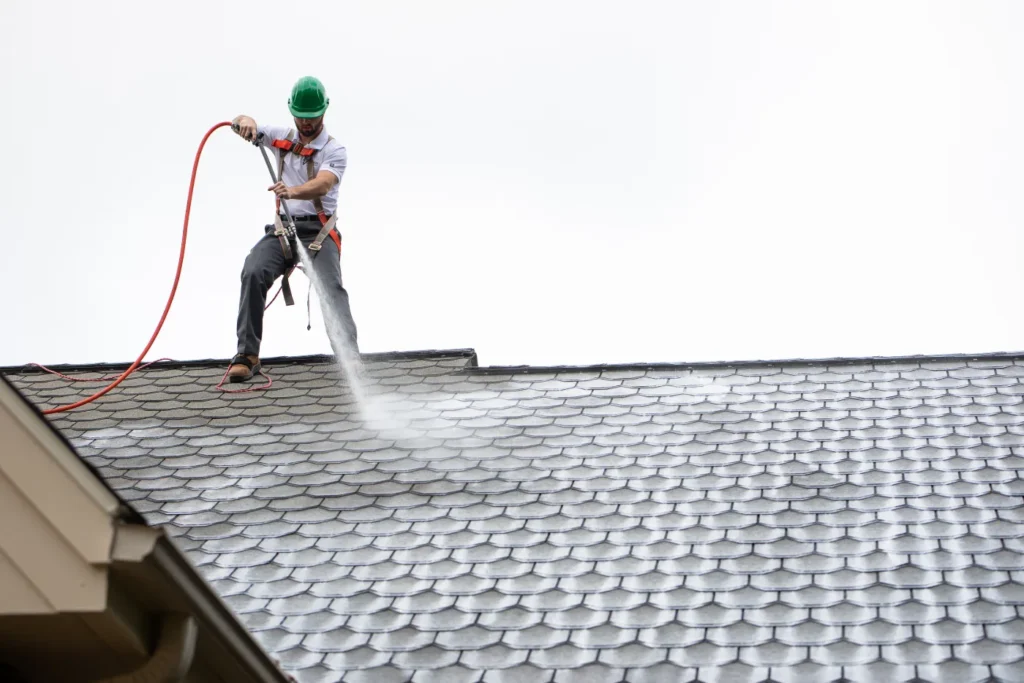 roof beinf sprayed with RoofMaxx treatment